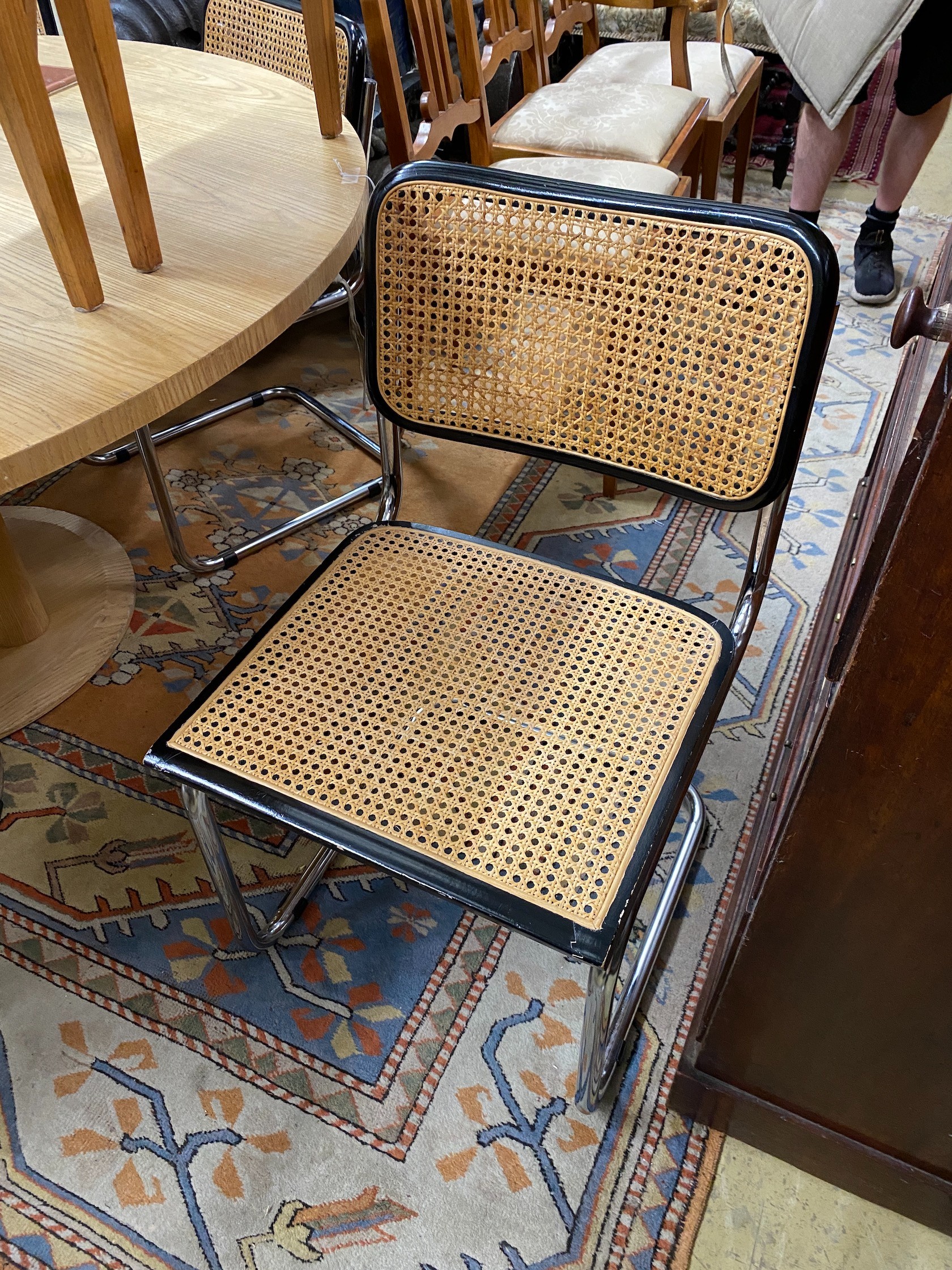 Six caned ebonized cantilever dining chairs in the style of Knoll Cesca by Marcel Breuer